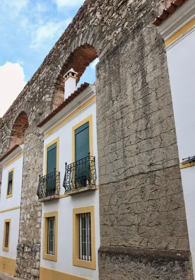 House built into aqueduct arch - Evora